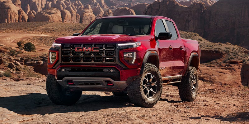 Red GMC canyon truck in the desert